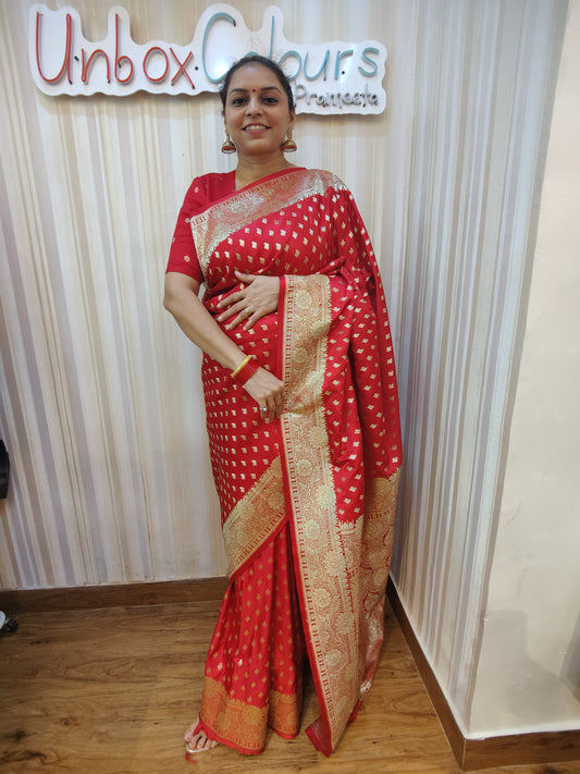 Make a bold statement with this bold Bloody Red Banarasi Ready to Wear Saree from Aura Drapes by Unbox Colours. Designed for effortless elegance & all-day comfort. Featuring rich red tones with luxurious golden sari detailing, this pre-stitched saree is perfect for weddings, house-warmings, festive celebrations, receptions, parties, Karwa Chauth, Diwali & special family celebrations. Traditional charm meets modern convenience-drape it in minute.