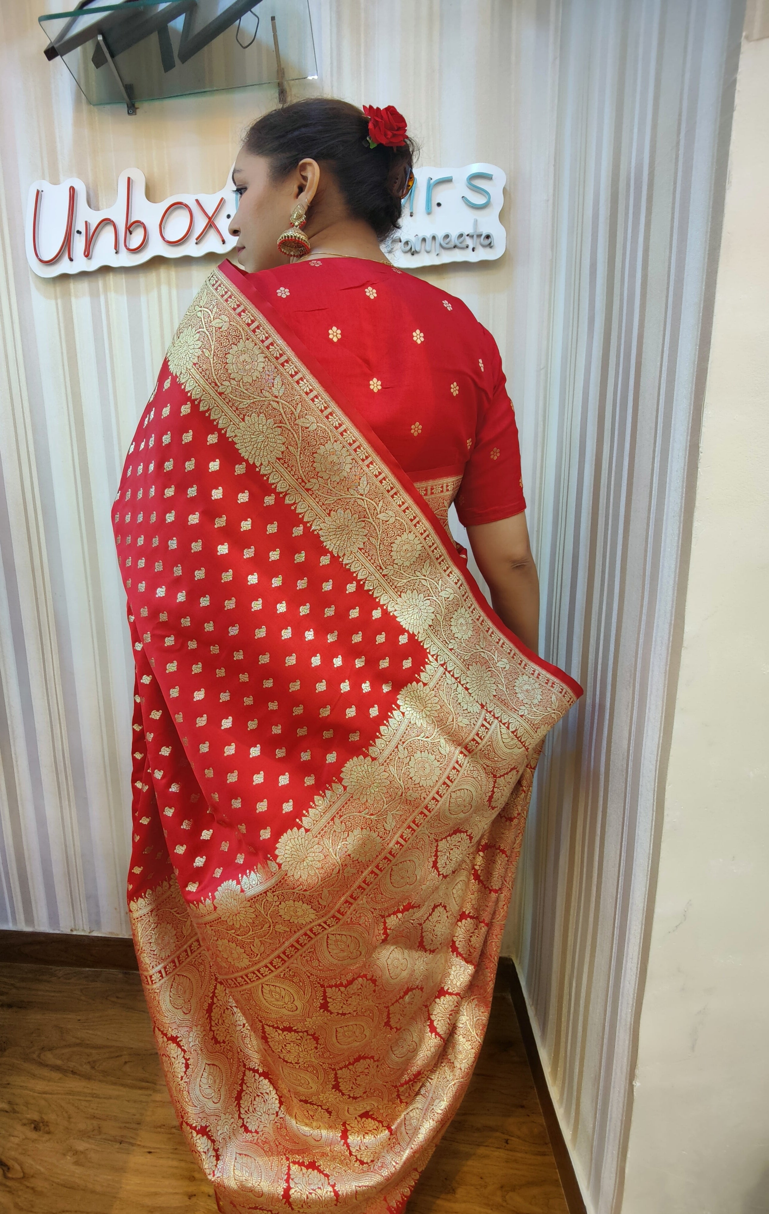 Make a bold statement with this bold Bloody Red Banarasi Ready to Wear Saree from Aura Drapes by Unbox Colours. Designed for effortless elegance & all-day comfort. Featuring rich red tones with luxurious golden sari detailing, this pre-stitched saree is perfect for weddings, house-warmings, festive celebrations, receptions, parties, Karwa Chauth, Diwali & special family celebrations. Traditional charm meets modern convenience-drape it in minute.