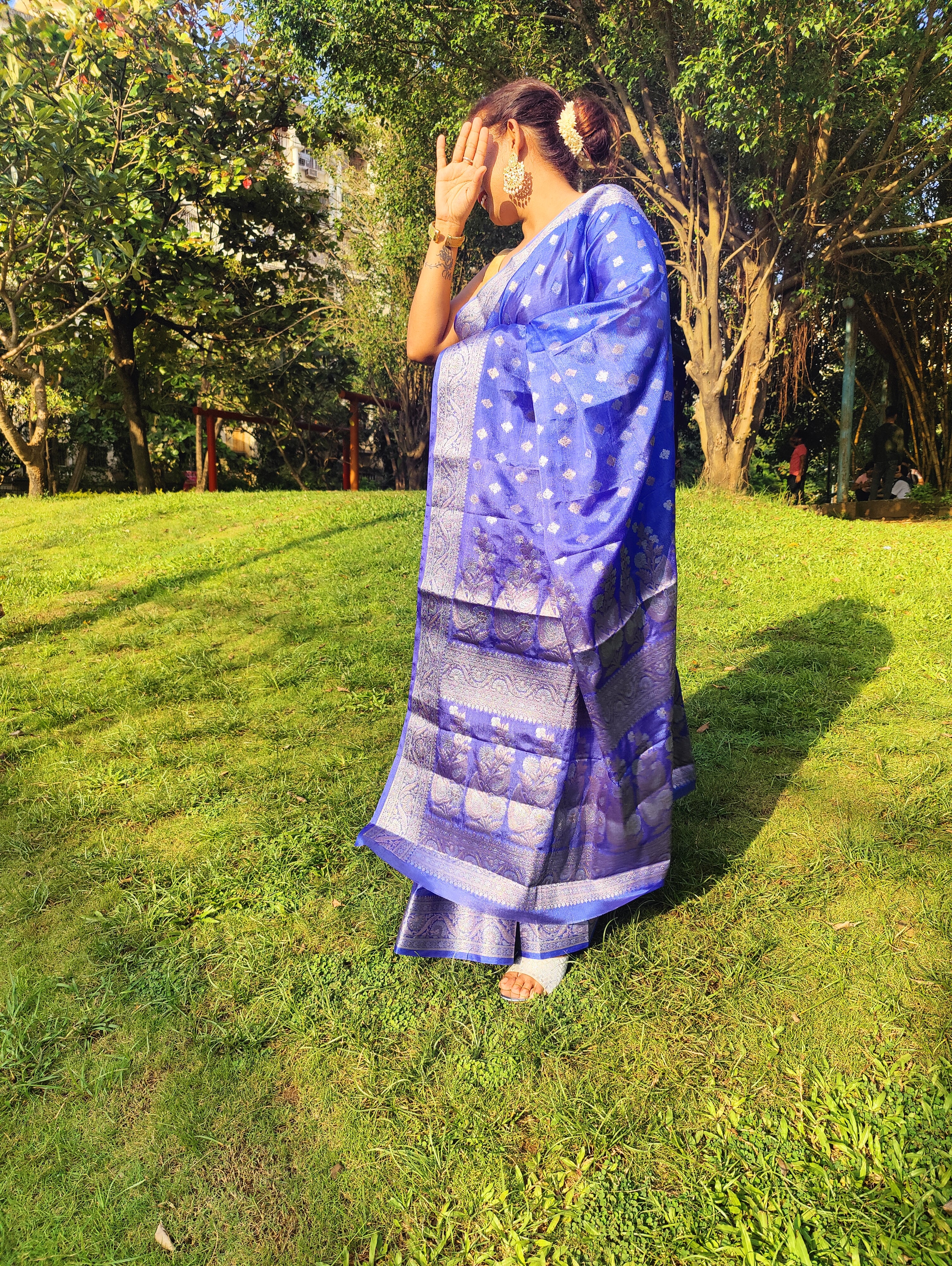 Grace every celebration with this Blue Ready-to-Wear Saree from Aura Drapes by Unbox Colours. This stunning Saree is crafted for effortless elegance & comfort. Featuring a rich Beautiful Blue shade with intricate woven detailing of Silver & Gold Zari. This pre-stitched saree is perfect for weddings, festive occasions, receptions, sangeet nights, family functions & party wear. Easy to drape & beautifully traditional, it’s designed to make you shine with confidence at every special moment.