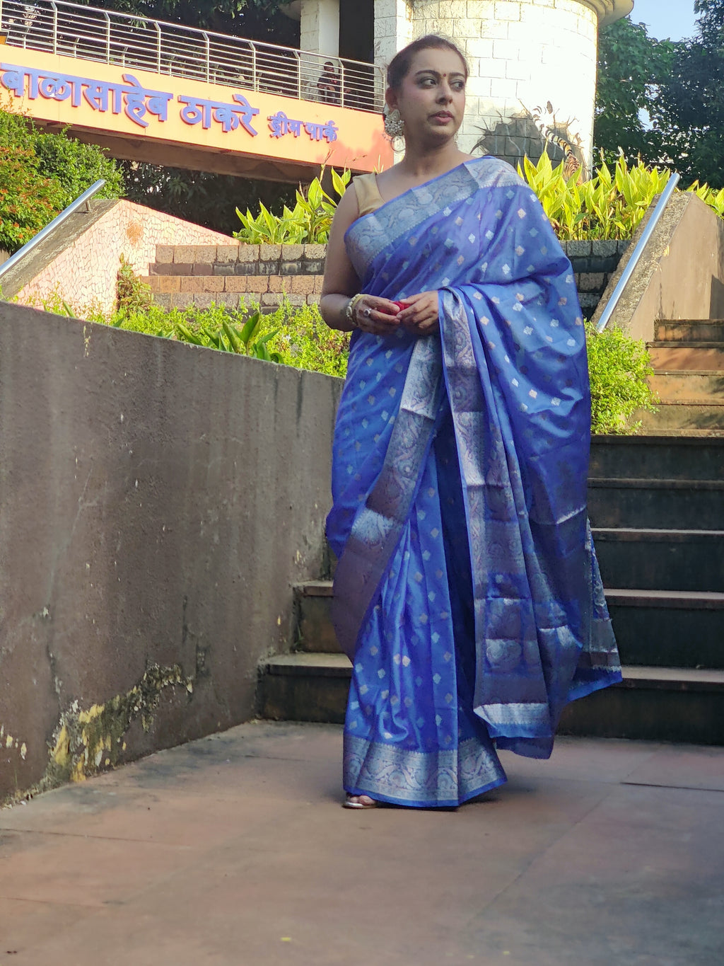 Grace every celebration with this Blue Ready-to-Wear Saree from Aura Drapes by Unbox Colours. This stunning Saree is crafted for effortless elegance & comfort. Featuring a rich Beautiful Blue shade with intricate woven detailing of Silver & Gold Zari. This pre-stitched saree is perfect for weddings, festive occasions, receptions, sangeet nights, family functions & party wear. Easy to drape &amp; beautifully traditional, it’s designed to make you shine with confidence at every special moment.