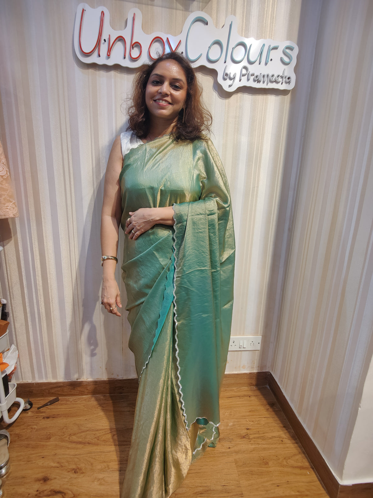 Embrace effortless elegance with Sage Green Shimmer, a graceful Soft Space Silk ready-to-wear saree from Aura Drapes by Unbox Colours, designed for style, comfort & modern sophistication. Featuring a soothing sage green shimmer with a soft, luxurious drape, this pre-stitched saree is perfect for festive celebrations, wedding functions, cocktail parties, receptions, day events & elegant family gatherings. Lightweight, stylish & easy to wear—drape it in minutes & shine with understated glamour.