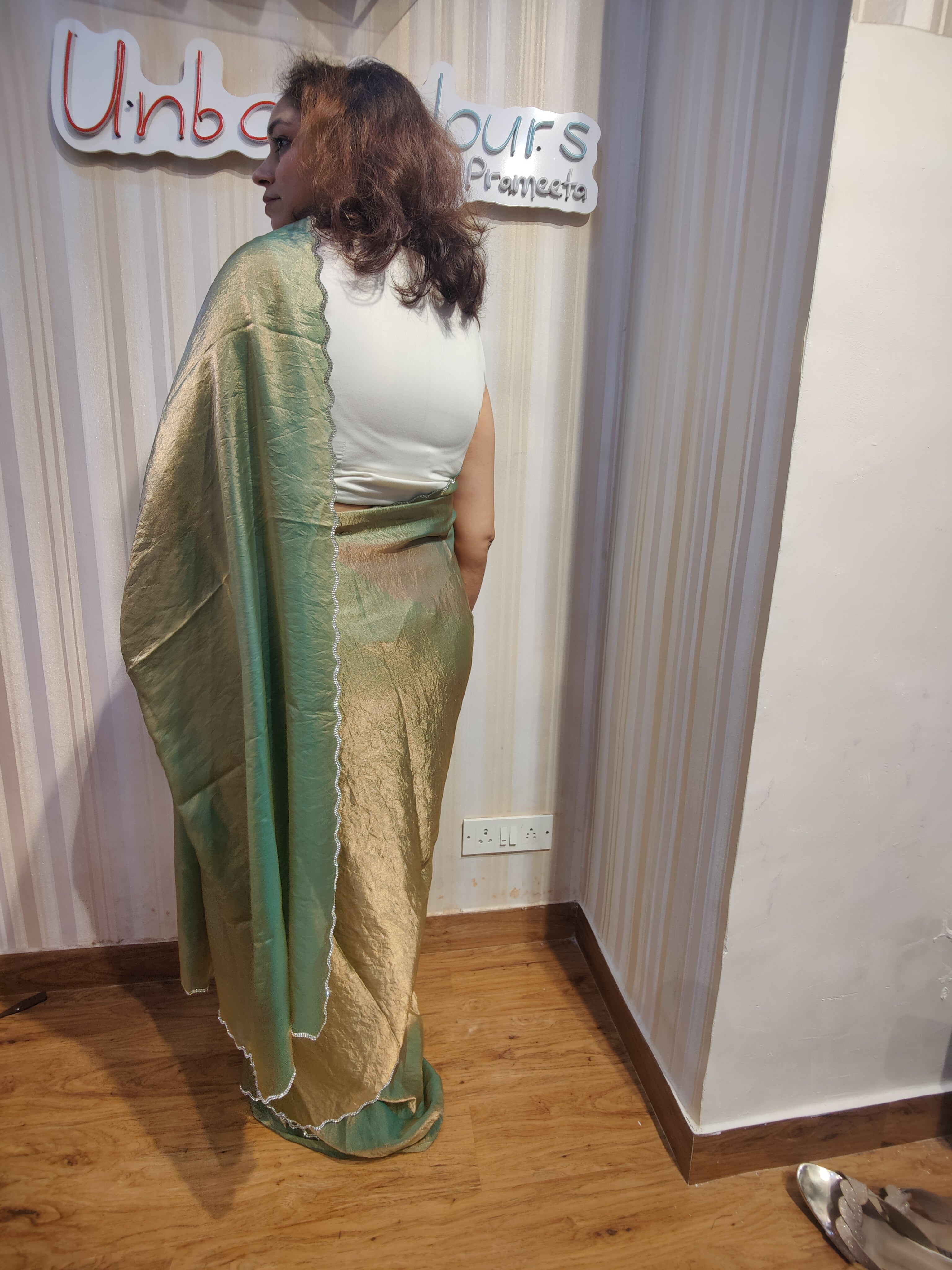 Embrace effortless elegance with Sage Green Shimmer, a graceful Soft Space Silk ready-to-wear saree from Aura Drapes by Unbox Colours, designed for style, comfort & modern sophistication. Featuring a soothing sage green shimmer with a soft, luxurious drape, this pre-stitched saree is perfect for festive celebrations, wedding functions, cocktail parties, receptions, day events & elegant family gatherings. Lightweight, stylish & easy to wear—drape it in minutes & shine with understated glamour.