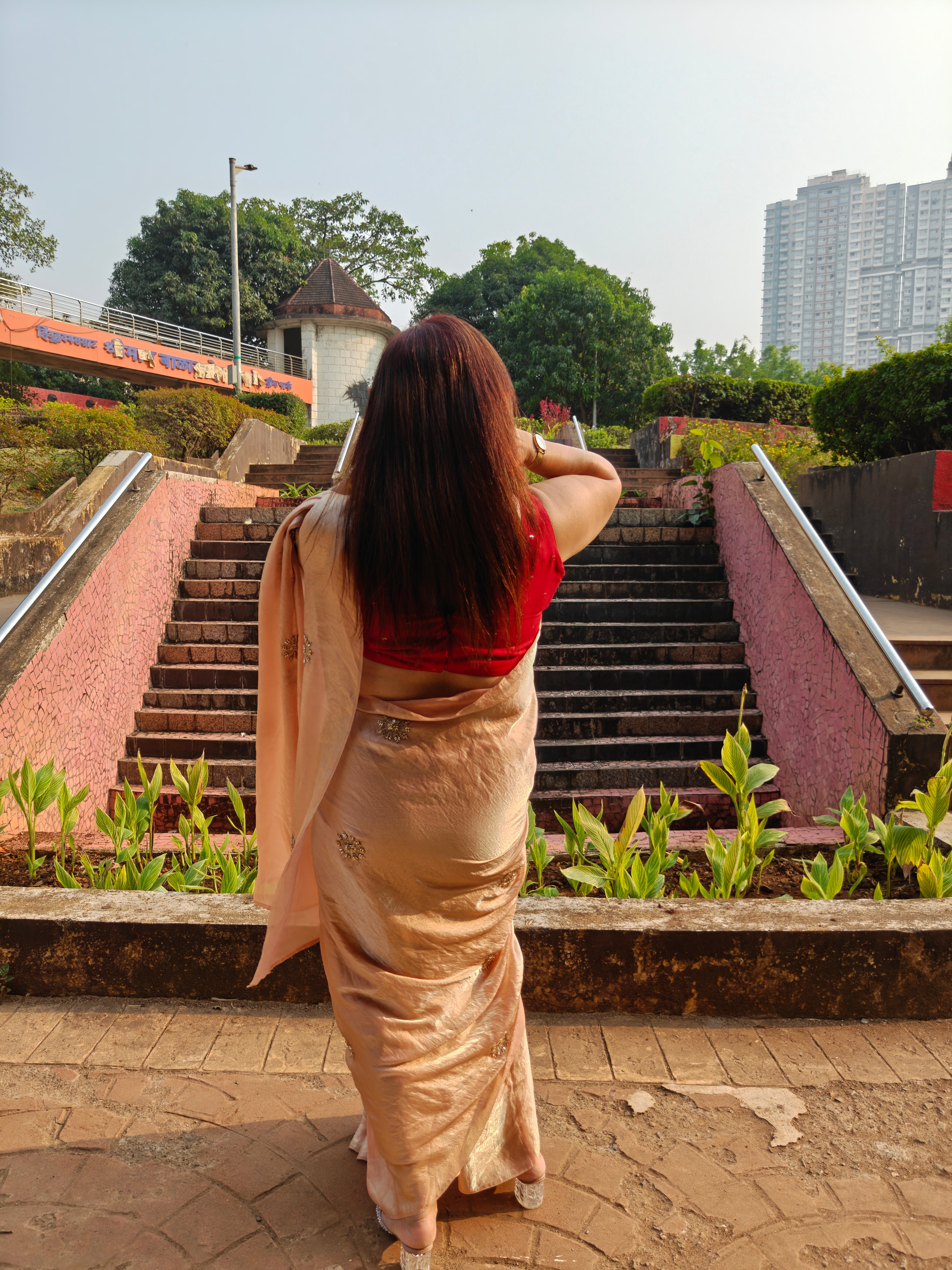 Elevate your festive & party look with this Champagne Gold Ready to Wear Saree from Aura Drapes by Unbox Colours. Designed for effortless draping, this pre-stitched saree combines timeless grace with modern comfort. Crafted in lightweight flowy fabric with delicate embellishments, it's perfect for festivals, weddings, parties & special occasions. Style, comfort & sophistication - ready in minutes.

It's peachy tone, combined with a modern, functional design, make it the perfect choice for every occasion.